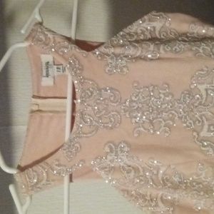 Size 12Y low high has a short tail back of dress zip closer halter style top